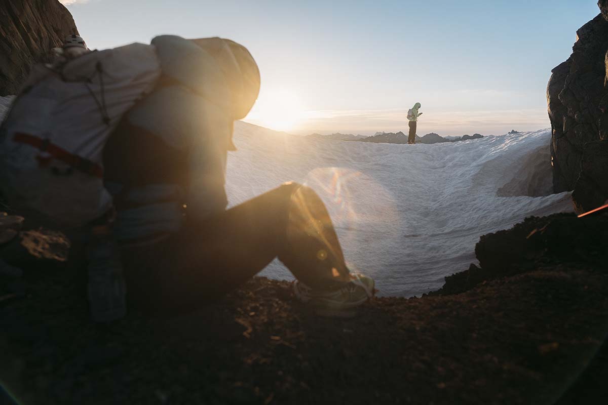 Putting on crampons during sunrise on the North Cascades High Route